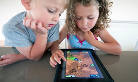 Children playing computer game on a  tablet computer