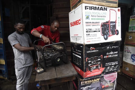NIGERIA-ECONOMY-OIL-ELECTRICITYTechnicians repair a generator in a shop at Yaba district of Lagos, on September 9, 2020. - The Nigerian government has dumped a decade-long pricing regime for petrol and electricity allowing marketers to fix prices resulting in anger and tension in the oil-rich Africa’s most populous country of 200 million people. (Photo by PIUS UTOMI EKPEI / AFP) (Photo by PIUS UTOMI EKPEI/AFP via Getty Images)