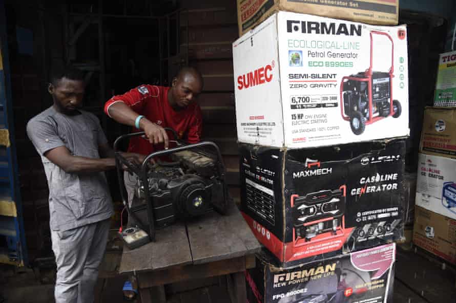 NIGERIA-ECONOMY-OIL-ELECTRICITYTechnicians repair a generator in a shop at Yaba district of Lagos, on September 9, 2020. - The Nigerian government has dumped a decade-long pricing regime for petrol and electricity allowing marketers to fix prices resulting in anger and tension in the oil-rich Africa's most populous country of 200 million people. (Photo by PIUS UTOMI EKPEI / AFP) (Photo by PIUS UTOMI EKPEI/AFP via Getty Images)