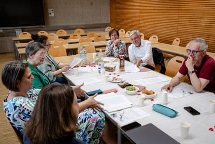 Volunteers get together monthly to discuss some of the letters.