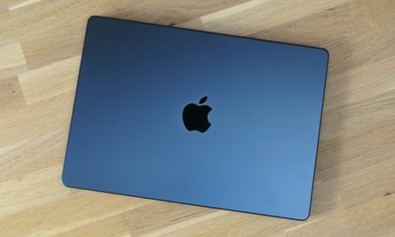 The lid of the space black 14in MacBook Pro.