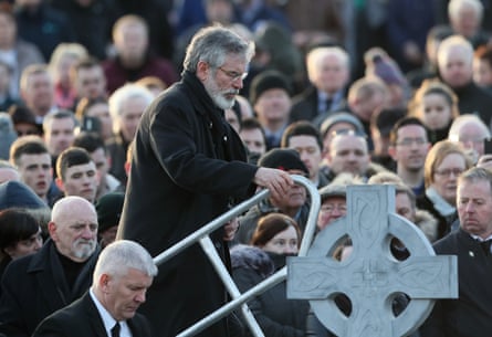 Gerry Adams steps up to speak at Derry city cemetery after the funeral service.