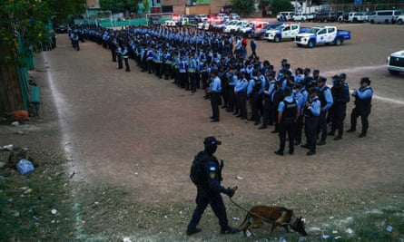 Members of the military police of public order get ready during a special operation in Tegucigalpa on 6 December.