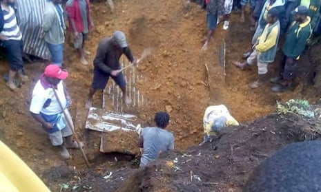 Rescuers dig for bodies in Mendi after the 26 February earthquake.
