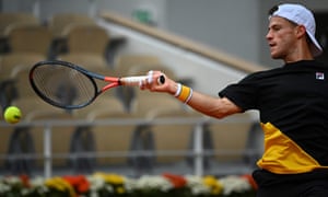 Diego Schwartzman returns the ball to Rafael Nadal.