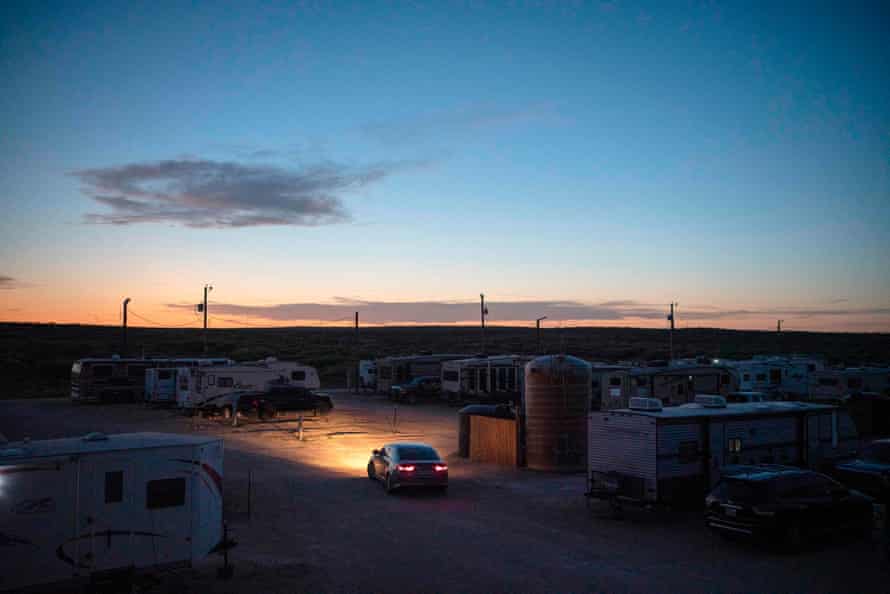 An RV park that is both a temporary and long-term home for many oil field workers is seen at dusk in Carlsbad, New Mexico.