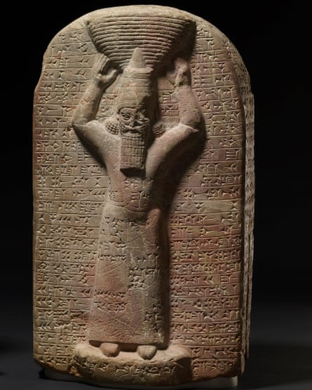 Ashurbanipal, shown with cuneiform inscription.