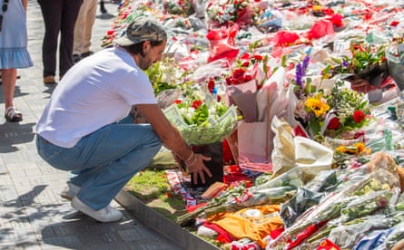Liverpool’s Dominik Szoboszlai lays flowers with the other tributes for his former teammate Diogo Jota at Anfield.