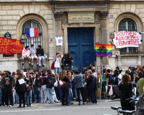 French high school students gather outside the Lycee Condorcet high school in Paris.