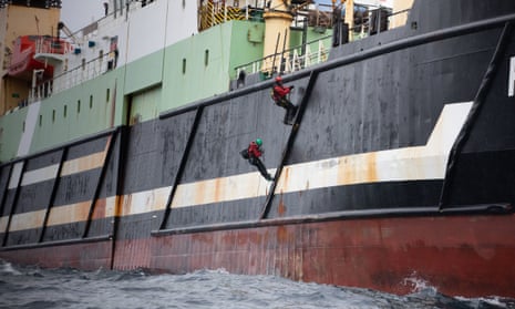 Greenpeace activists board a supertrawler in the North Sea to prevent it from fishing in protected waters. 