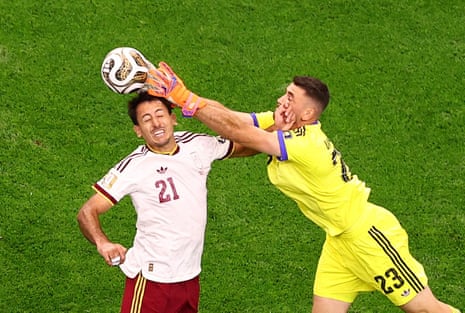 Spain's keeper Unai Simon and Mikel Oyarzabal go for the same ball.