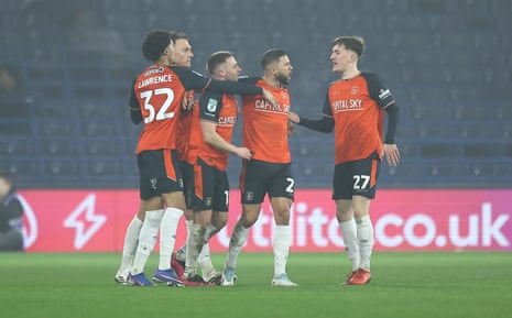 Nahki Wells (second right) celebrates with teammates after scoring Luton Town’s equaliser.