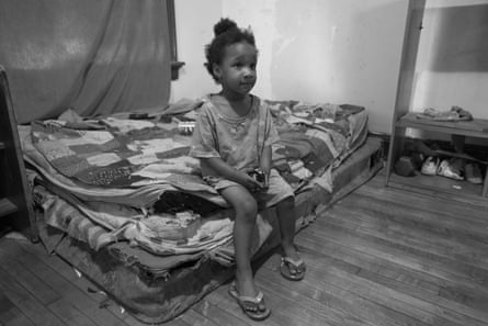 A child in a substandard home that her family had to accept after being evicted from their previous home in Milwaukee.