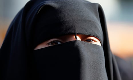 Critics say the new law could potentially exclude women who wear the niqab or burqa from accessing health services, sitting for school exams or riding the bus.
