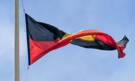 An Indigenous flag at half-mast