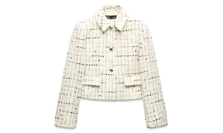 A Chanel-style textured blazer in cream with black flecks and buttons