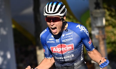 Alpecin-Deceuninck team’s Belgian rider Jasper Philipsen celebrates winning the stage.