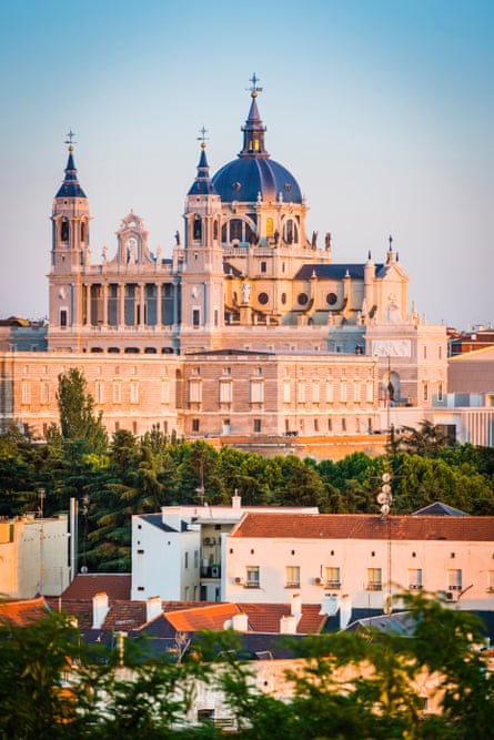 Sunset hues: the Almudena Cathedral overlooking the rooftop’s of Madrid.