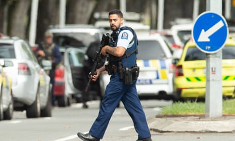 Armed police patrol the scene where the mass shooting occurred