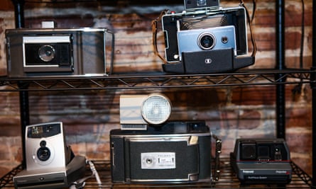 Vintage polaroid cameras sit on a shelf inside Polaroid Swing’s San Francisco office.