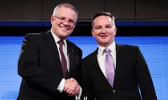Scott Morrison and Chris Bowen shake hands after the treasurers’ debate at the National Press Club on Friday.