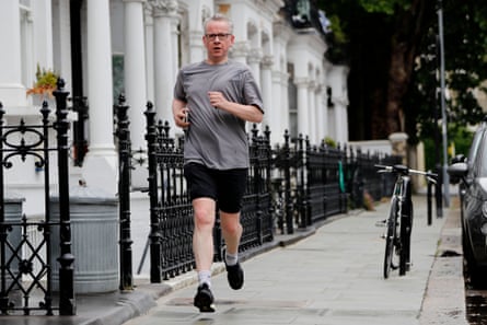 Michael Gove running down a London street