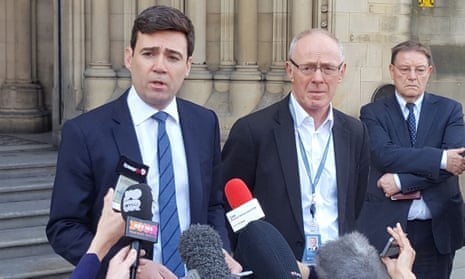 Andy Burnham and Manchester City Council Leader Sir Richard Leese speak to the media outside Manchester Town Hall.