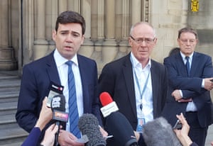 Mayor of Greater Manchester Andy Burnham and Manchester city council leader Sir Richard Leese speak to the media outside Manchester town hall
