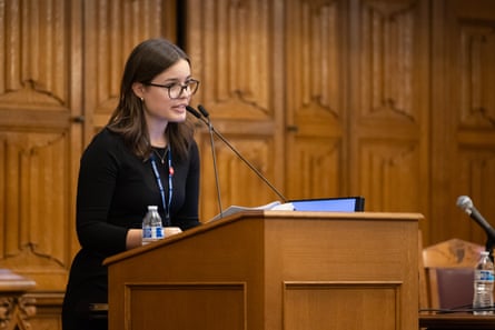 a woman speaks into a microphone