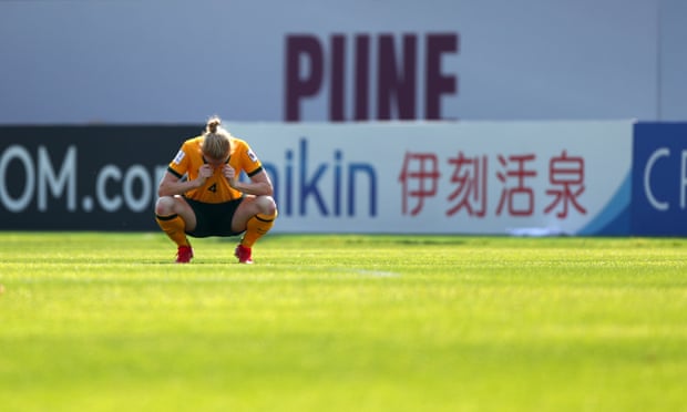 A dejected Clare Polkinghorne slumps on her haunches after the Matildas’ 1-0 defeat to South Korea in the Asian Cup quarter-finals.
