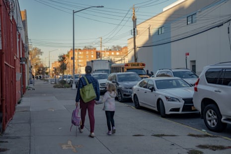 Monitoring Amazon: the New Yorkers monitoring air pollution from supply hubs | Amazon 2 cars and trucks drive past a school