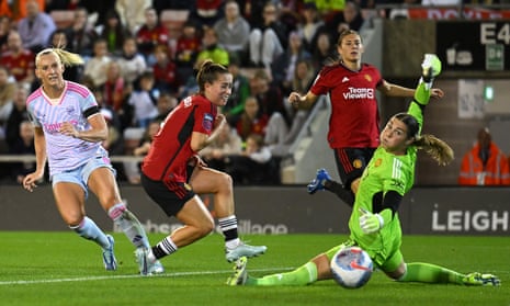 Stina Blackstenius of Arsenal scores the team’s first goal past Mary Earps of Manchester United during the Barclays Women’s Super League match between Manchester United and Arsenal.