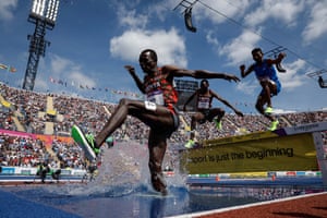 Amos Serem of Kenya leaps over the water jump during the men’s 3000m steeplechase final