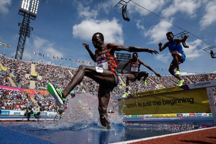 Amos Serem of Kenya leaps over the water jump during the men’s 3,000m steeplechase final.