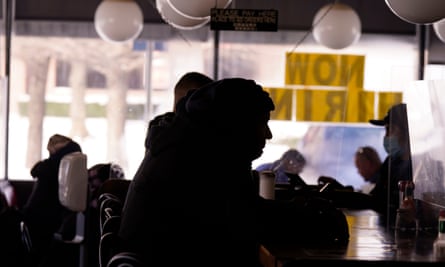 People sit in restaurant without power amid cold weather in Richardson, Texas, in February 2021.