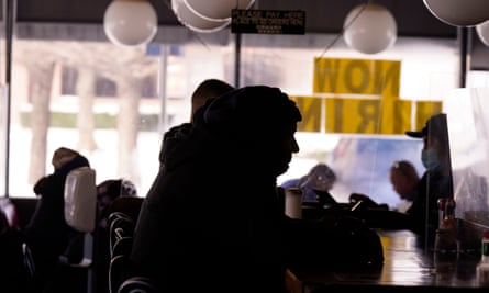 Patrons sit in restaurant without power caused by cold weather blackouts in Richardson, Texas, on 16 February.
