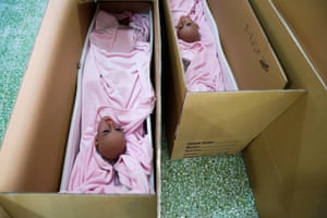 Dolls’ heads are put in boxes ready to ship to customers