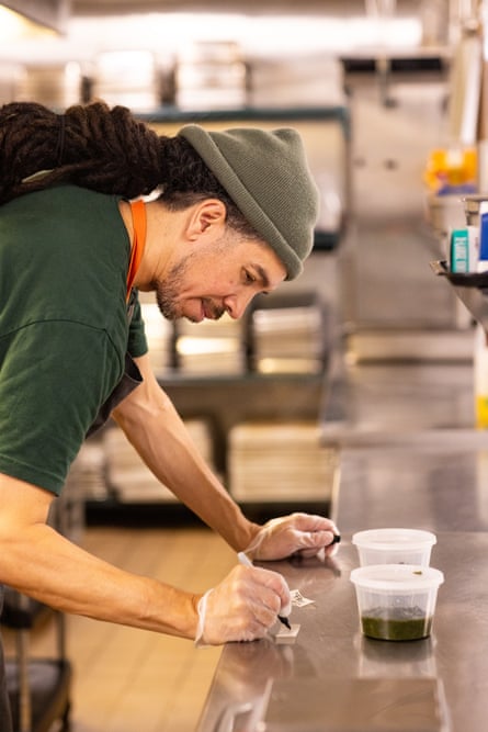 a person writing something on tape