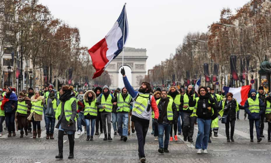 A gilets jaunes protest in Paris in December 2018, over planned fuel price rises resulting from a carbon tax.
