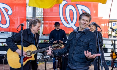 Kevin Bacon performing with his older brother Michael Bacon (left) at a Bacon Brothers gig