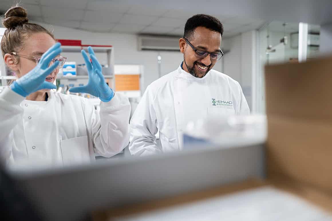 Yaw Bediako and a colleague working in the lab
