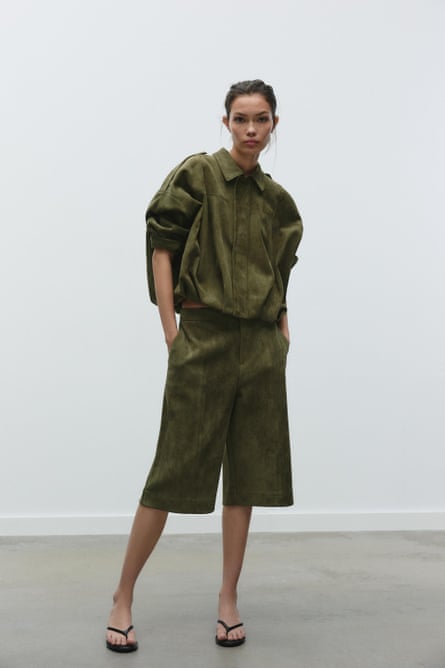 Model wearing khaki suede jacket and matching knee-length short