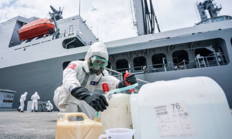 Soldiers from Taiwan’s chemical units disinfecting the Panshi supply ship in Kaohsiung, south Taiwan.