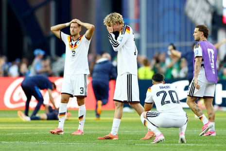 Germany’s Nick Woltemade and Waldemar Anton look dejected.