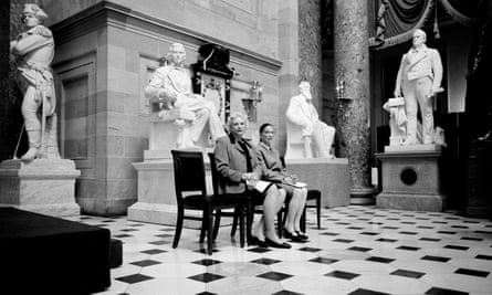 Sandra Day O’Connor and Ruth Bader Ginsburg pose for a portrait 28 March 2001 surrounded by statues of men at the Capitol building.