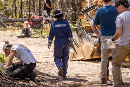 Victoria police and forensics search for the remains of missing campers Russell Hill and Carol Clay in bushland north of Dargo on 30 November 2021.