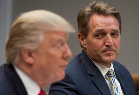 Jeff Flake listens as Donald Trump speaks at the White House on 5 December 2017. 