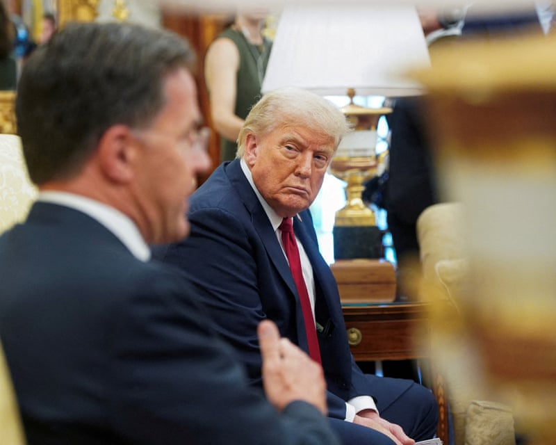 Donald Trump listens to Mark Rutte in the Oval Office