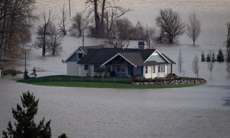 A house is seen surrounded by floodwaters on a farm in Abbotsford, British Columbia on Tuesday.