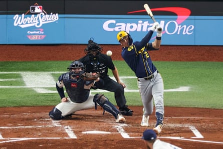 Cooper Pratt hits an RBI single in the second inning of Game 5 on Wednesday. The rookie drove in two runs as Milwaukee clinched their first World Series title.